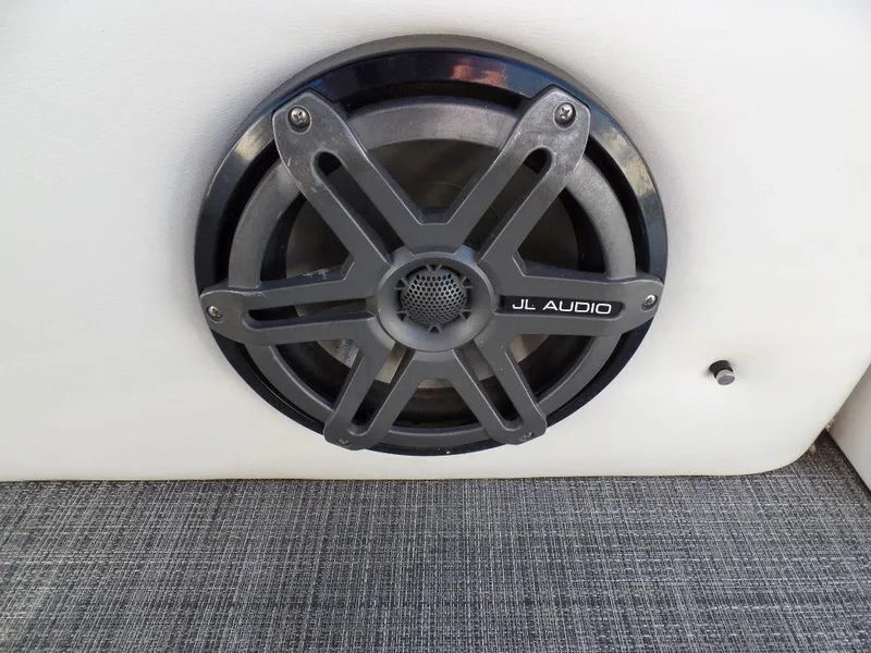 Slide: The Image of JL Audio speaker on 2017 JC Sporttoon 28TT boat, close-up view. - 24