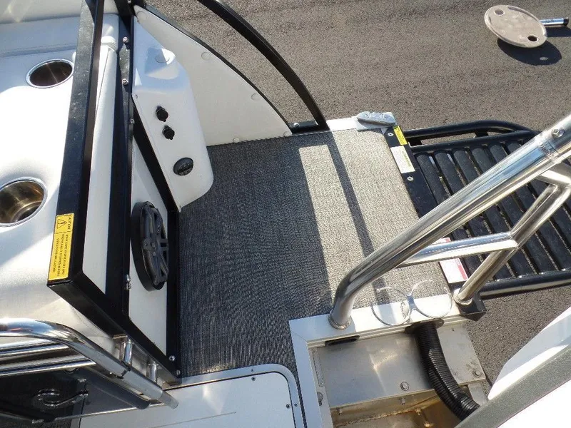 Slide: The Image of 2017 JC Sporttoon 28TT boat interior with stainless steel railings and cup holders. - 29