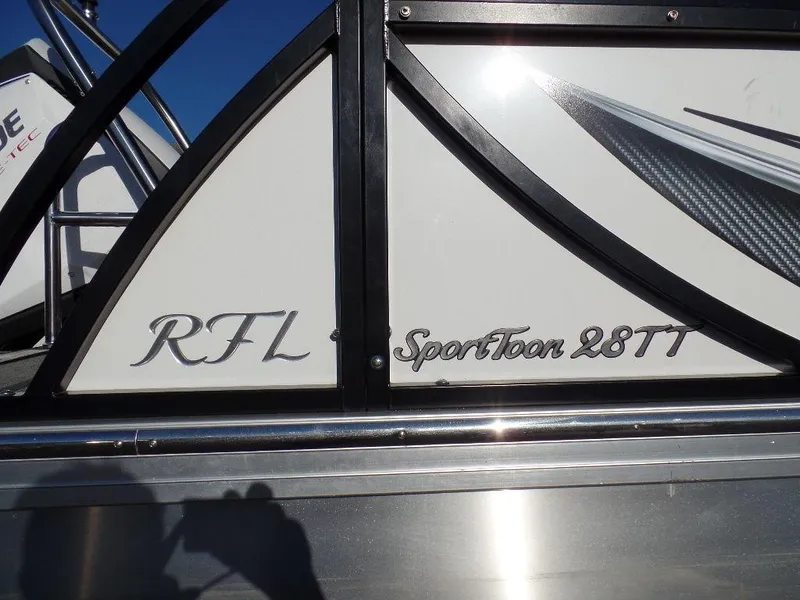 Slide: The Image of 2017 JC Sporttoon 28TT boat side view with model name and RFL initials. - 3