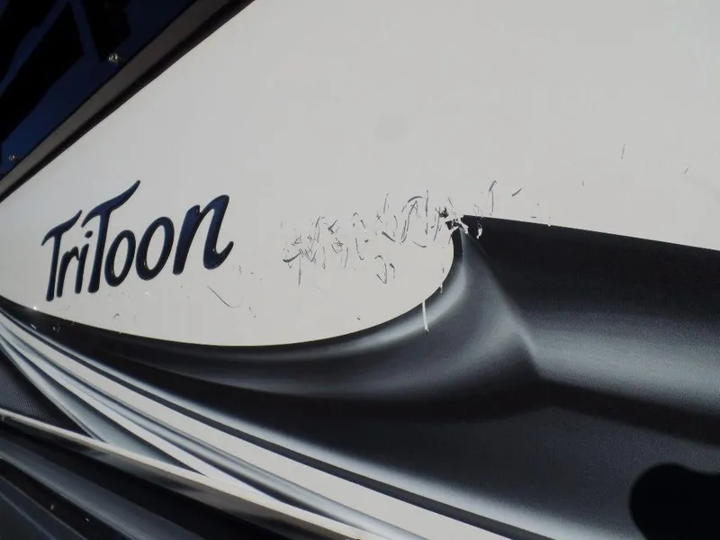 Slide: The Image of Close-up of 2017 JC Sporttoon 28TT boat with minor hull damage. - 32