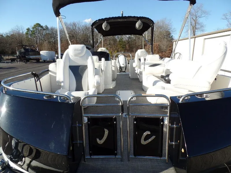 Slide: The Image of 2017 JC Sporttoon 28TT pontoon boat with white seating and black canopy. - 6