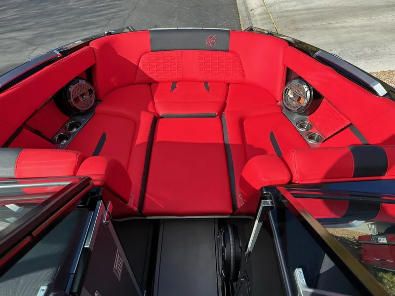 Slide: The Image of 2020 MasterCraft X24 boat with red interior seating and premium sound system. - 6
