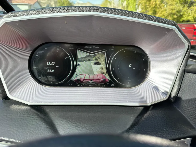 Slide: The Image of 2020 MasterCraft X24 dashboard with digital display and rearview camera. - 9