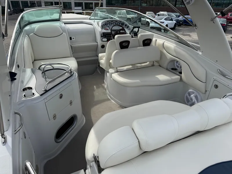 Slide: The Image of 2008 Crownline 315 SCR boat interior with white seating and modern dashboard. - 7
