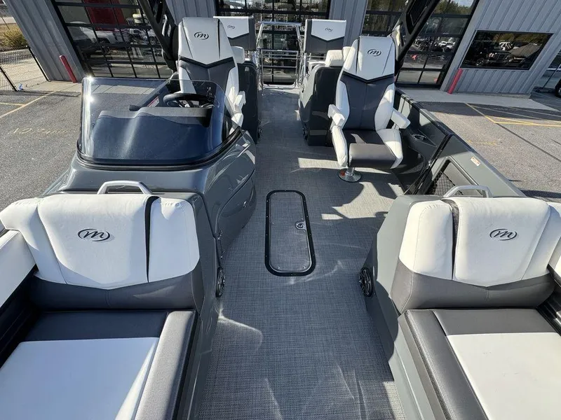 Slide: The Image of 2024 Manitou XT 23 Split Rear Sport (SRS) Single Engine V-Toon interior, showcasing luxurious seating and modern design. - 13