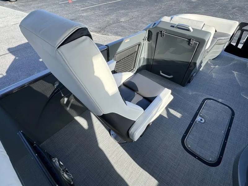 Slide: The Image of 2024 Manitou XT 23 SRS Single Engine V-Toon interior seating and flooring. - 15