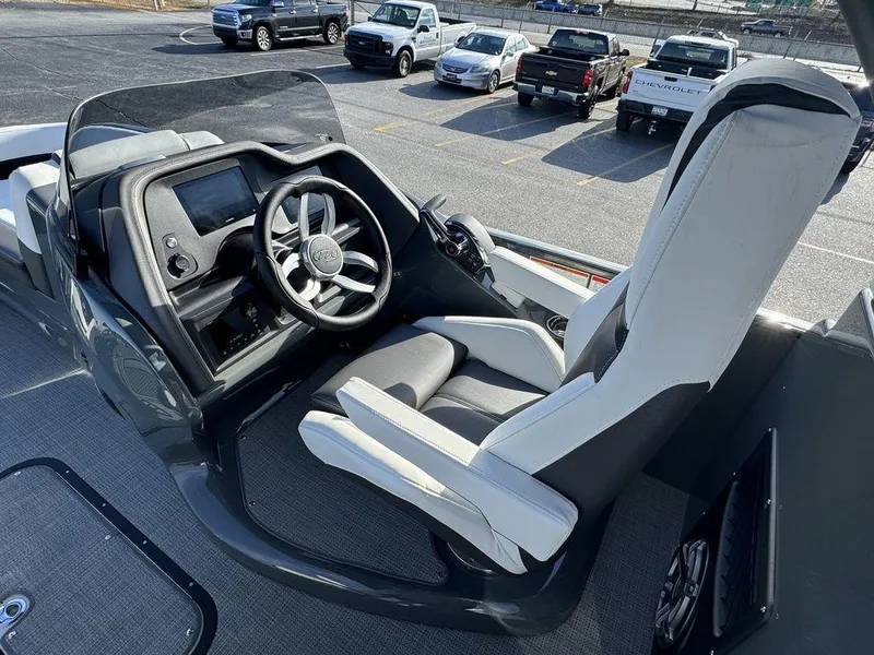 Slide: The Image of 2024 Manitou XT 23 Split Rear Sport (SRS) Single Engine V-Toon cockpit with modern steering and controls. - 16