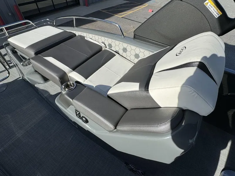 Slide: The Image of 2024 Manitou XT 23 Split Rear Sport (SRS) Single Engine V-Toon boat seating area. - 23