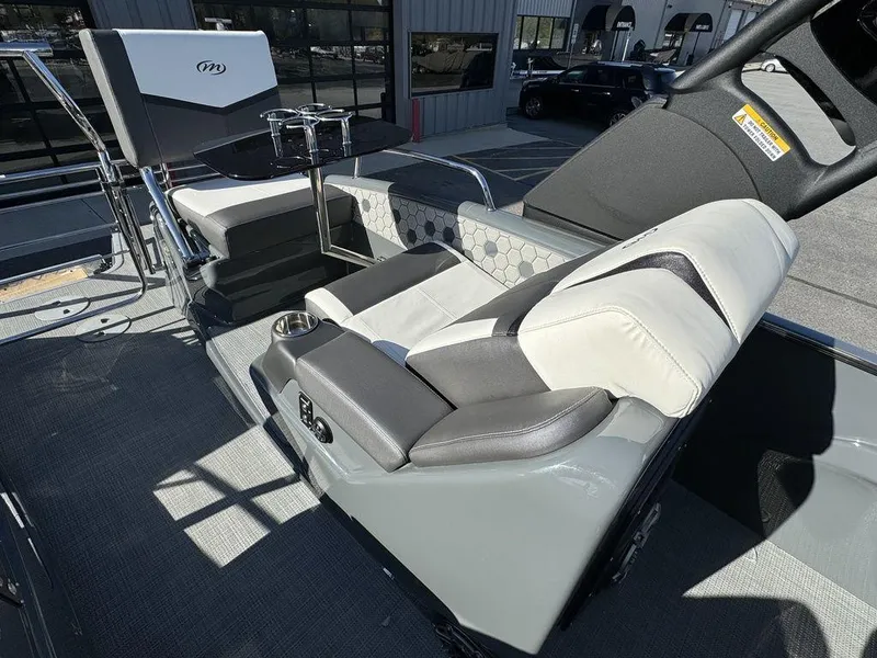 Slide: The Image of 2024 Manitou XT 23 Split Rear Sport (SRS) Single Engine V-Toon interior seating. - 25