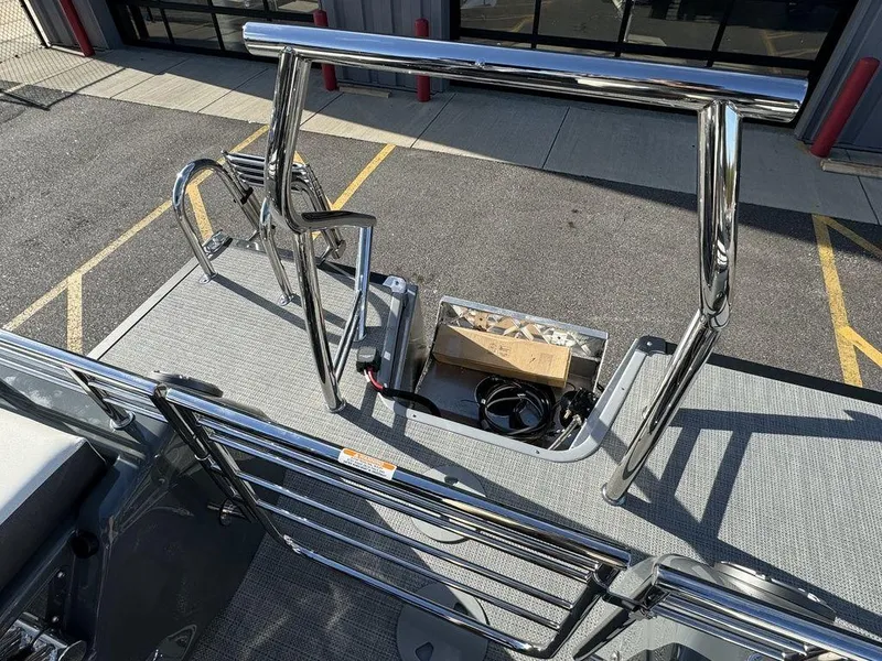 Slide: The Image of 2024 Manitou XT 23 Split Rear Sport (SRS) Single Engine V-Toon boat deck and ladder. - 26