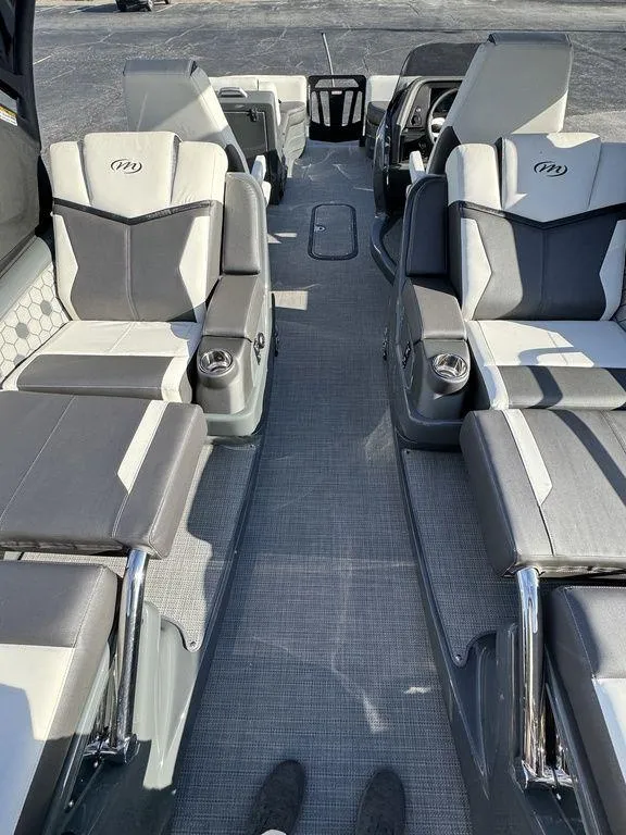 Slide: The Image of 2024 Manitou XT 23 Split Rear Sport (SRS) Single Engine V-Toon interior with luxurious seating. - 28