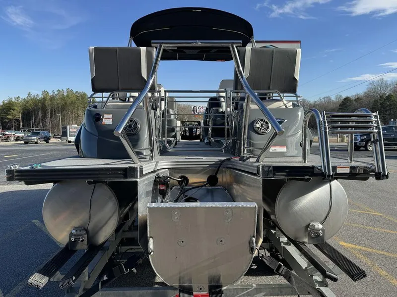 Slide: The Image of 2024 Manitou XT 23 Split Rear Sport (SRS) Single Engine V-Toon pontoon boat rear view. - 4