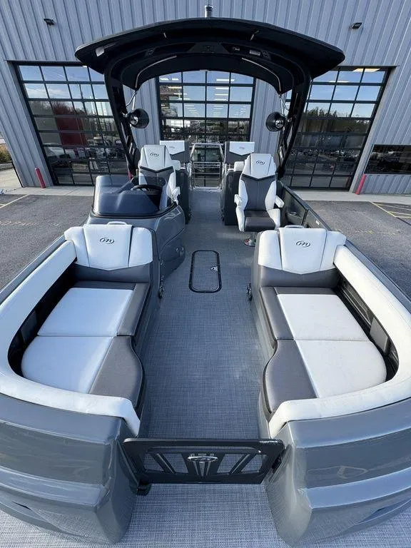 Slide: The Image of 2024 Manitou XT 23 Split Rear Sport (SRS) Single Engine V-Toon boat interior. - 9