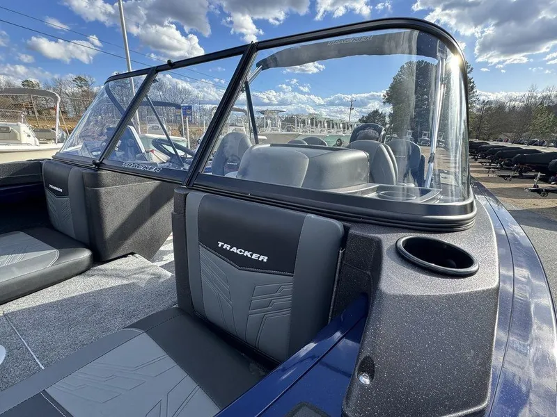 Slide: The Image of 2024 Tracker Targa™ V-18 Combo boat interior with windshield and seating. - 12