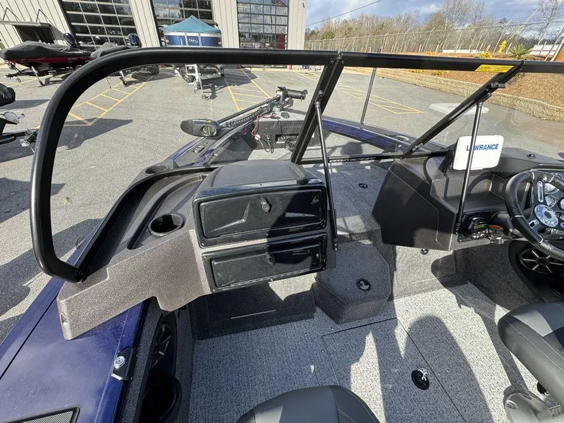 Slide: The Image of 2024 Tracker Targa™ V-18 Combo boat interior with dashboard and seating. - 16
