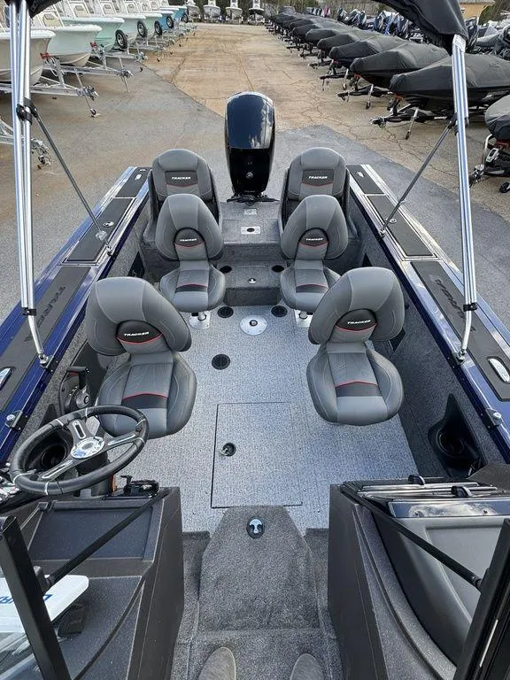 Slide: The Image of 2024 Tracker Targa™ V-18 Combo boat interior with seating and steering wheel. - 17