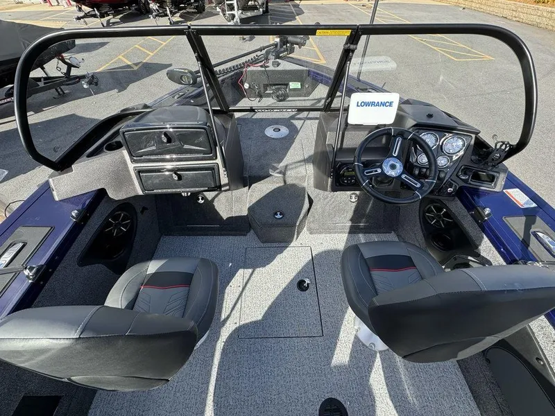 Slide: The Image of 2024 Tracker Targa™ V-18 Combo boat interior with steering console and seating. - 19