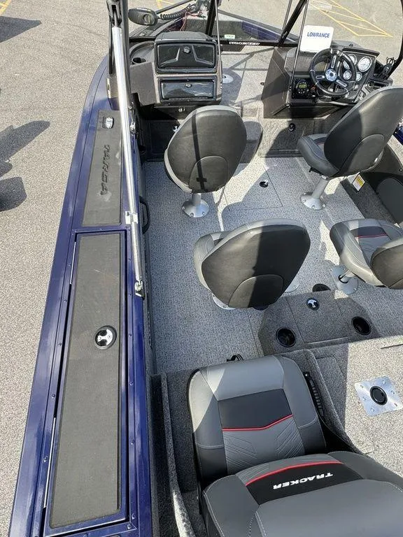 Slide: The Image of 2024 Tracker Targa™ V-18 Combo boat interior with seating and dashboard. - 23