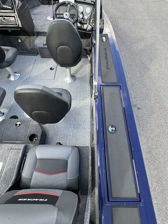 Slide: The Image of 2024 Tracker Targa™ V-18 Combo boat interior with seating and steering console. - 25