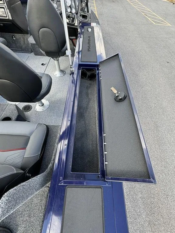 Slide: The Image of 2024 Tracker Targa™ V-18 Combo boat interior with open storage compartment. - 26