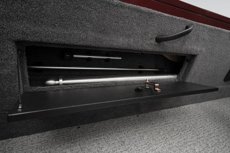 Slide: The Image of 2024 Tracker Targa™ V-18 Combo rod storage compartment with carpeted interior. - 43