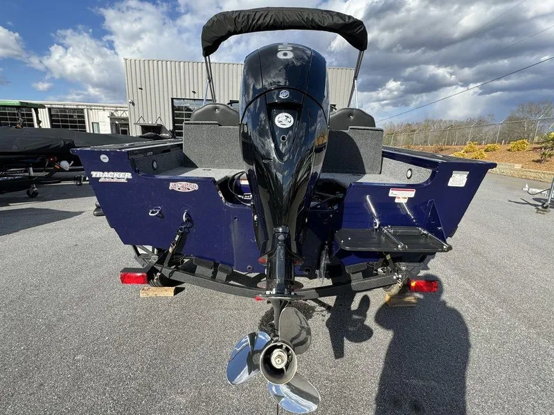 Slide: The Image of 2024 Tracker Targa™ V-18 Combo boat rear view with outboard motor. - 5