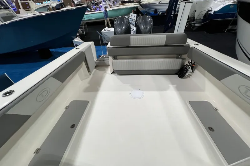 Slide: The Image of 2025 Defiance 260 Admiral boat interior with seating and storage compartments. - 10