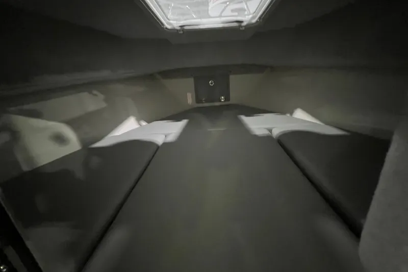 Slide: The Image of Interior cabin view of 2025 Defiance 260 Admiral boat, featuring sleek design and comfortable seating. - 13