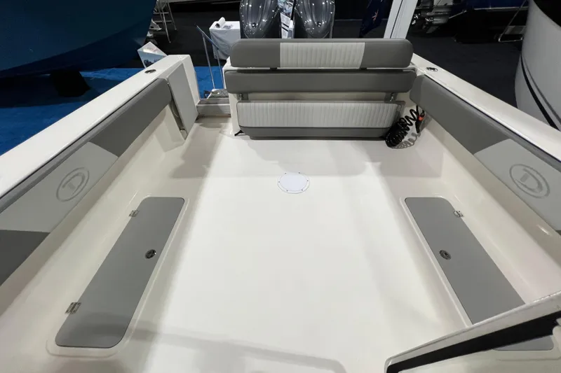 Slide: The Image of 2025 Defiance 260 Admiral boat interior with seating and storage compartments. - 9