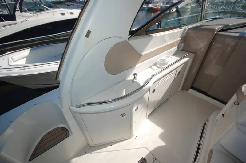Slide: The Image of Interior view of 2000 Sea Ray 380 Sundancer yacht with sink and storage. - 16