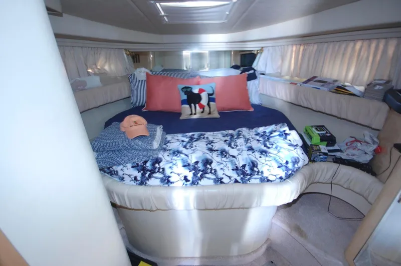 Slide: The Image of Cozy bedroom in 2000 Sea Ray 380 Sundancer yacht with bed and decorative pillows. - 19
