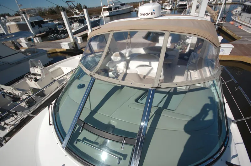 Slide: The Image of 2000 Sea Ray 380 Sundancer yacht docked at marina with Garmin navigation system. - 4
