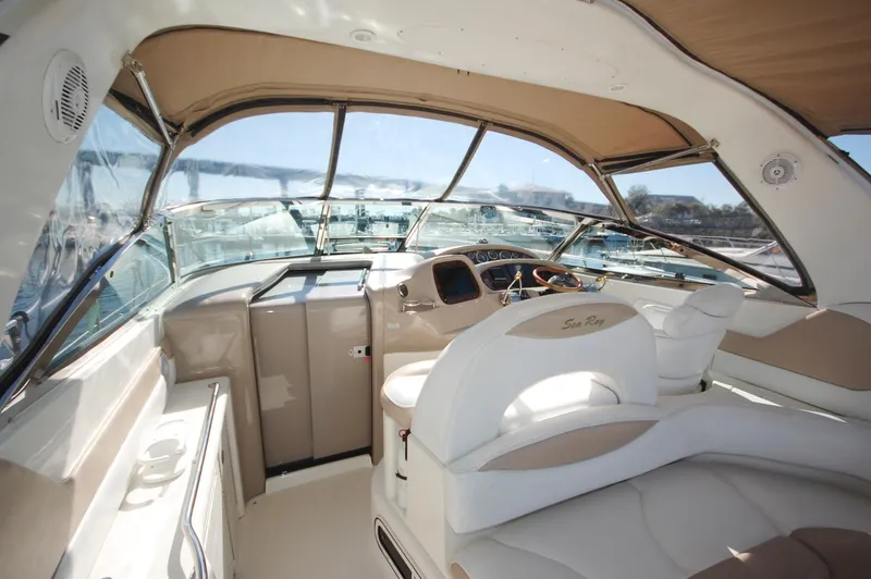 Slide: The Image of Interior cockpit of 2000 Sea Ray 380 Sundancer yacht with beige and white seating. - 6
