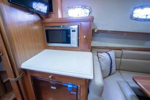 Slide: The Image of Interior of 2016 Marlow M34 Pilot yacht with microwave and seating area. - 26
