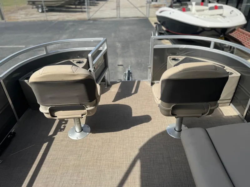 Slide: The Image of 2024 Sun Tracker Fishin' Barge 20 DLX boat with two fishing seats on deck. - 10