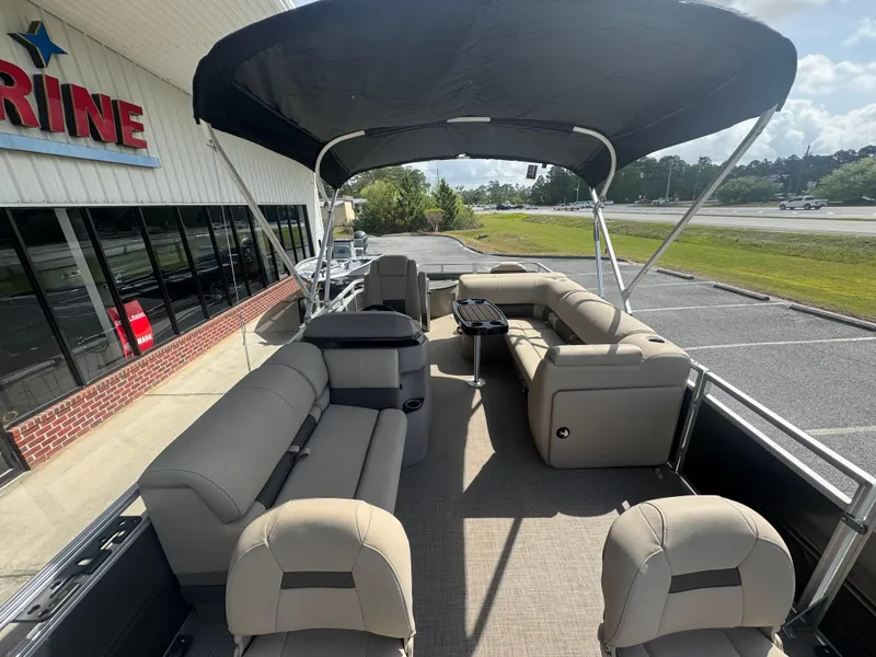Slide: The Image of 2024 Sun Tracker Fishin' Barge 20 DLX pontoon boat with spacious seating and canopy. - 11