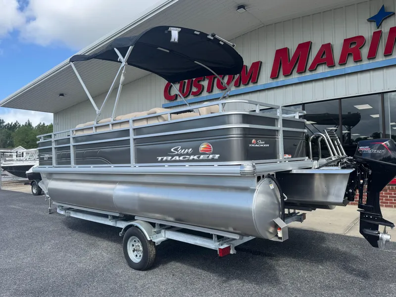Slide: The Image of 2024 Sun Tracker Fishin' Barge 20 DLX pontoon boat at Custom Marine dealership. - 3