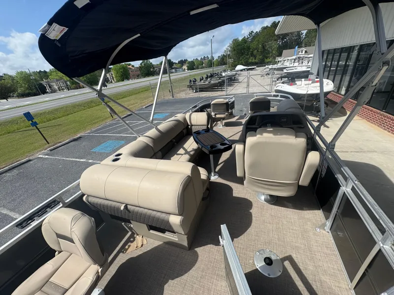 Slide: The Image of 2024 Sun Tracker Fishin' Barge 20 DLX pontoon boat with spacious seating and canopy. - 7