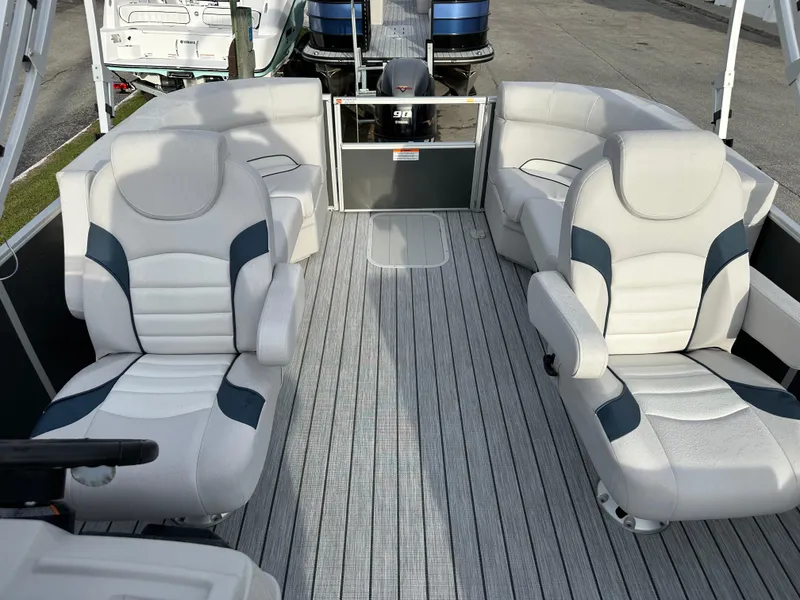 Slide: The Image of 2024 SunCatcher Select 20RC pontoon boat interior with plush seating and modern design. - 11