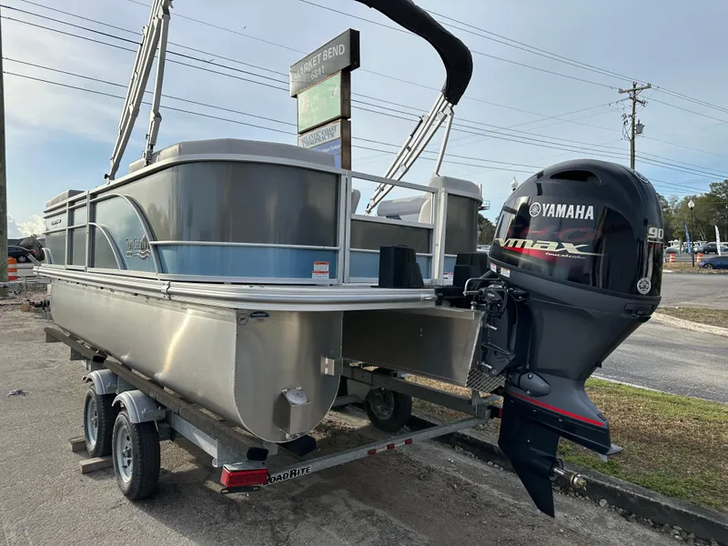 Slide: The Image of 2024 SunCatcher Select 20RC pontoon boat with Yamaha 90HP engine on trailer. - 5