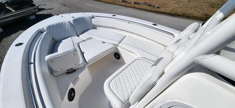 Slide: The Image of 2024 Sea Fox 248 Side Console boat with white cushioned seating. - 10