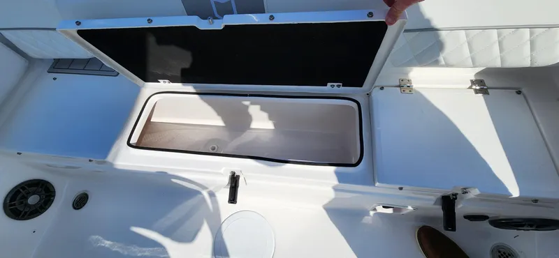 Slide: The Image of 2024 Sea Fox 248 Side Console boat storage compartment open. - 11