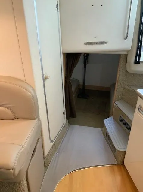 Slide: The Image of Interior of 2000 Maxum 3300 SCR boat with seating and cabin entrance. - 21