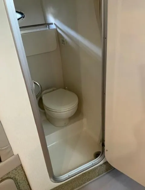 Slide: The Image of Compact bathroom in 2000 Maxum 3300 SCR boat. - 23