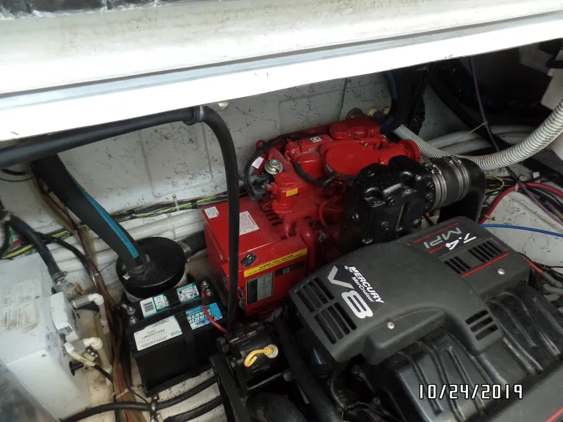 Slide: The Image of Engine compartment of a 2000 Maxum 3300 SCR boat with a Mercruiser V8 engine. - 32