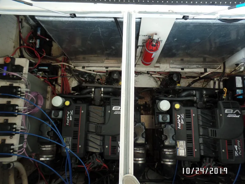 Slide: The Image of Engine compartment of a 2000 Maxum 3300 SCR boat with twin V8 engines. - 33