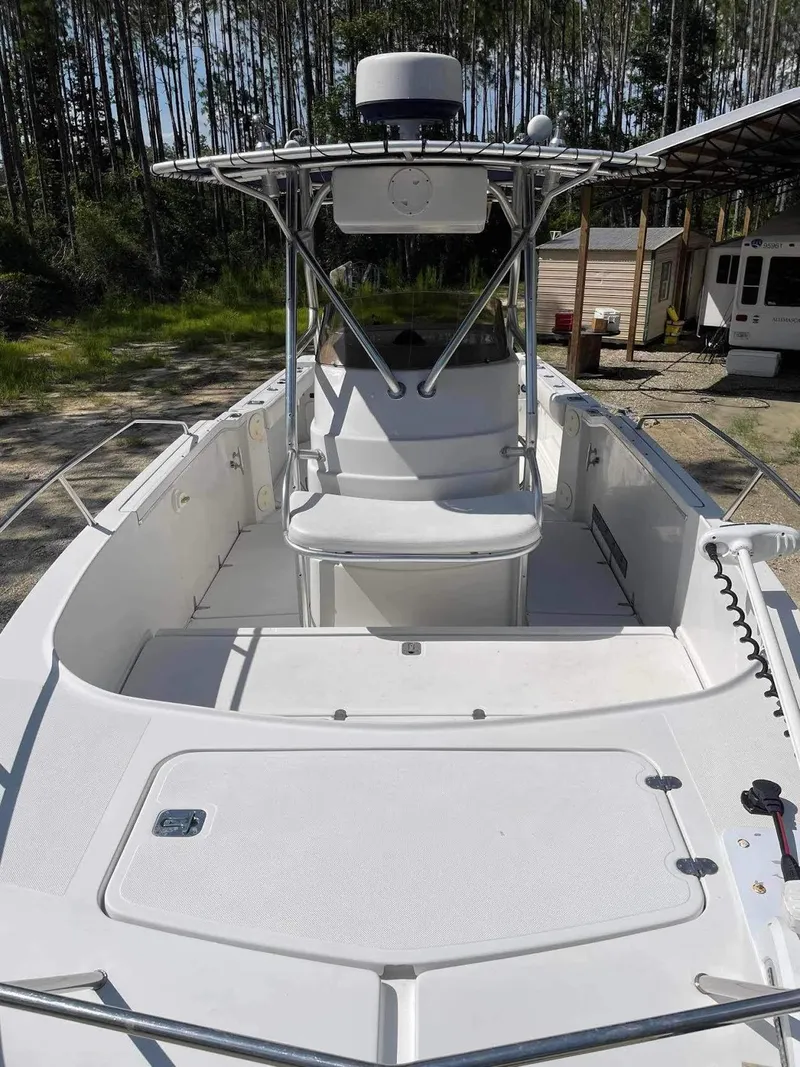 Slide: The Image of 2000 Glacier Bay 260 Canyon Runner boat with open deck and canopy. - 13