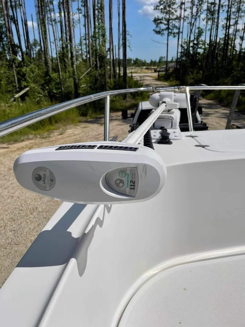 Slide: The Image of 2000 Glacier Bay 260 Canyon Runner boat with trolling motor, forest background. - 15