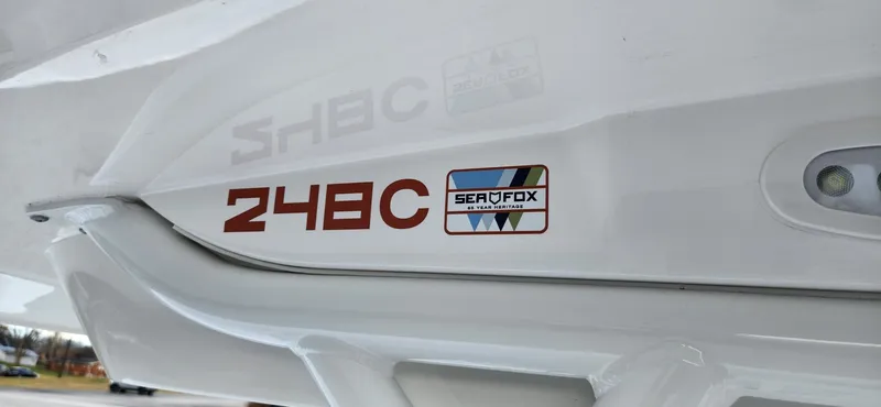 Slide: The Image of 2024 Sea Fox 248 Commander boat logo and model number on white hull. - 11