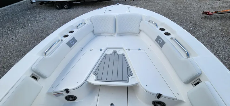 Slide: The Image of 2024 Sea Fox 248 Commander boat interior with cushioned seating and storage compartments. - 13